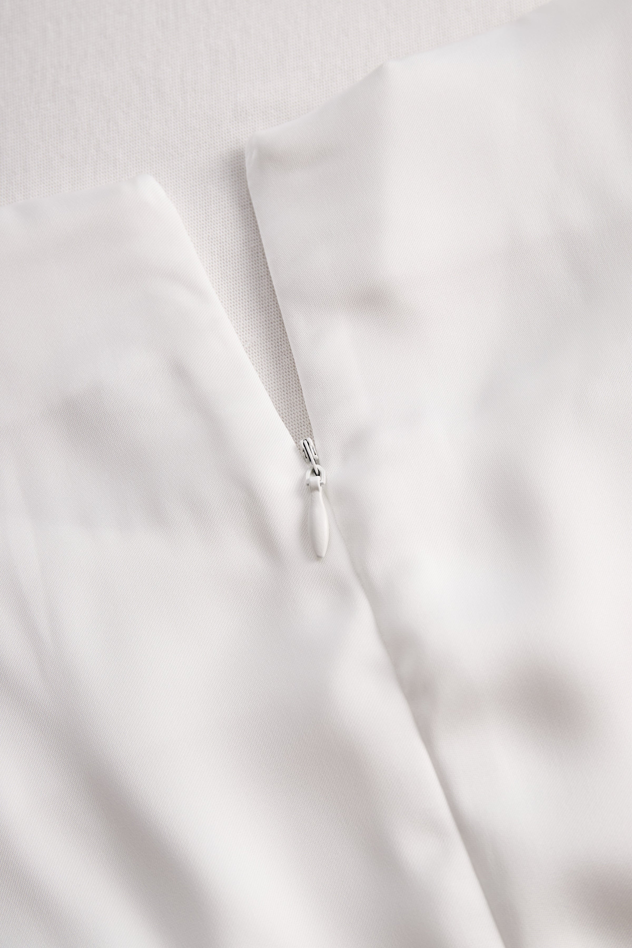 Elegant White Draped Top with Button Detail